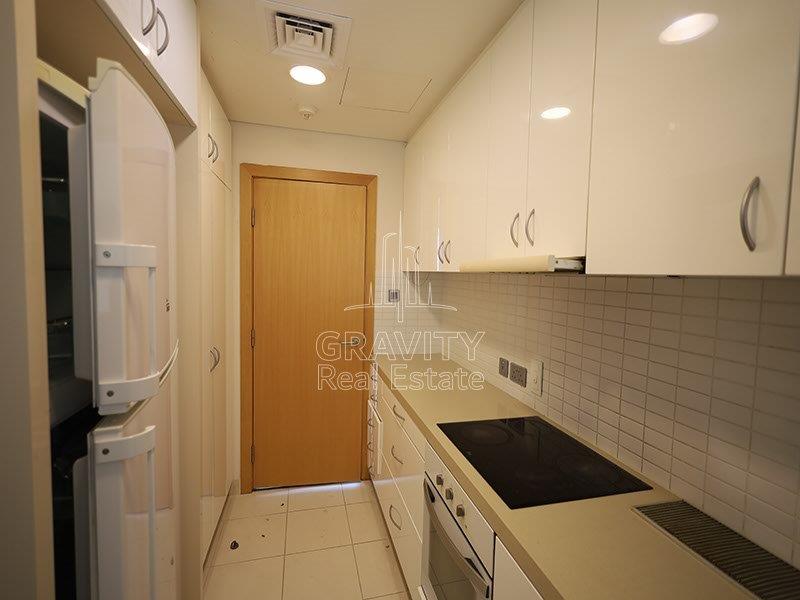 sleek-and-modern-closed-kitchen--of-a-3-bedroom-apartment-in-al-nada-1-raha-beach