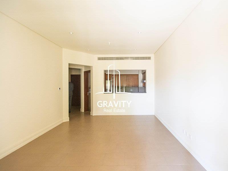 spacious-living-area-with-attched-kitchen-of-a-2-bedroom-apartment-in-saadiyat-island-beach-residence-for-sale