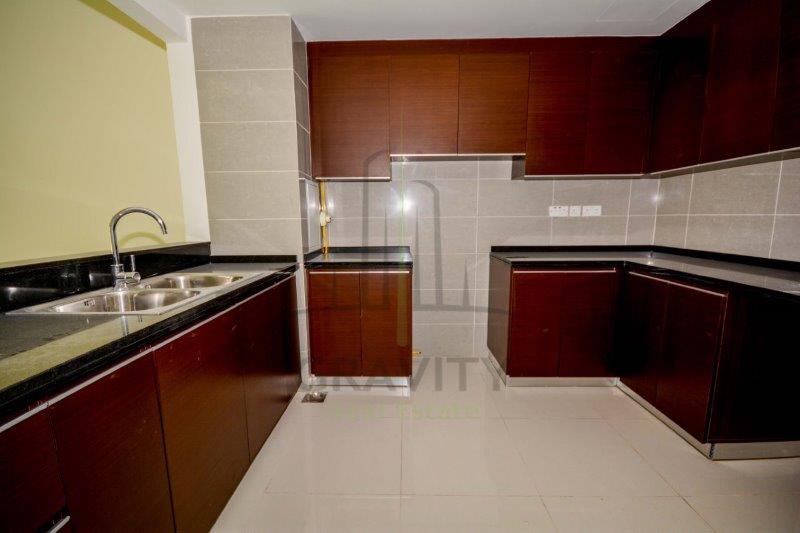 spacious-open-kitchen-area-with-nicely-fitted-cupboards-burooj-views-tower