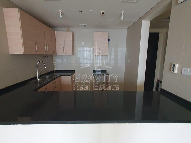 well-kept-open-kitchen-area-wih-plenty-of-cupboards-tala-tower-reem-island