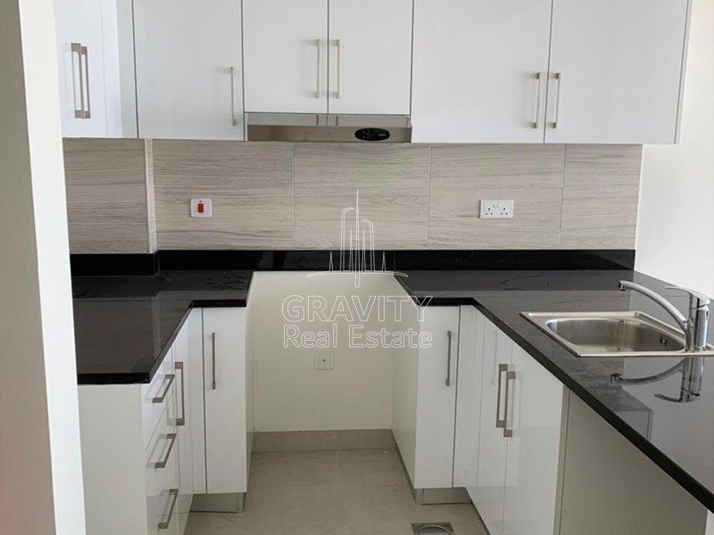 well-kept-open-kitchen-area-with-black-white-theme-saadiyat-soho-square