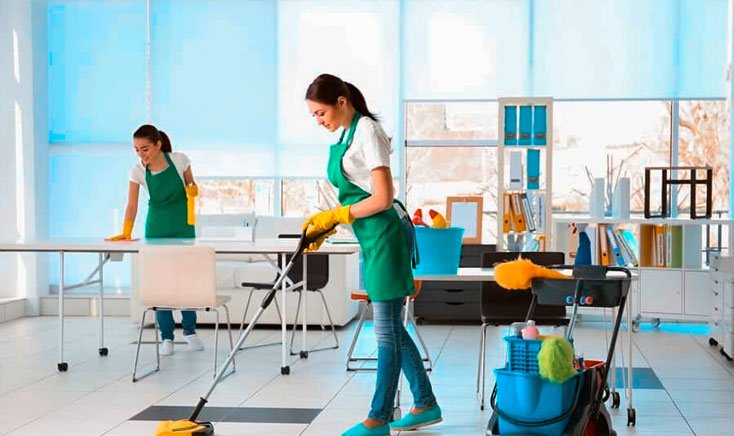 amana-cleaning-female-staff-with-green-aprons-cleaning-a-commercial-area