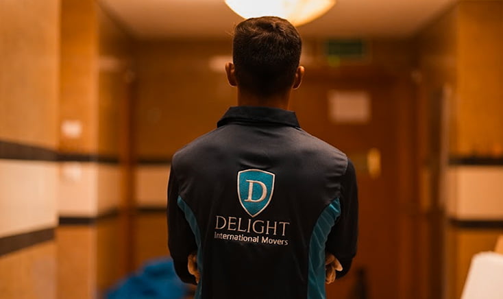 delight-international-movers-staff-with-company-giving-the-camera-his-back