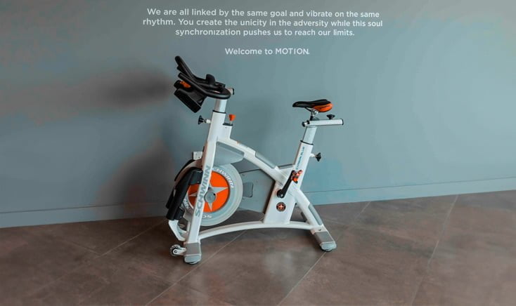 motion-cycling-reem-island-gym-cycling-machine-on-ceramic-floor