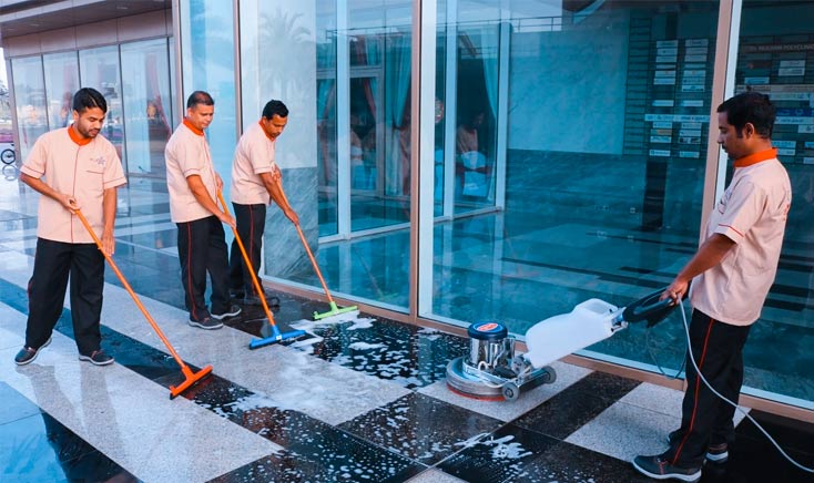 a-team-of-four-sky-star-cleaners-cleaning-the-outdoor-ceramics-of-a-building