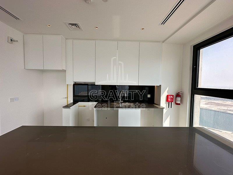 kitchen-of-a-2-bedroom-apartment-in-pixels-reem-island-for-sale