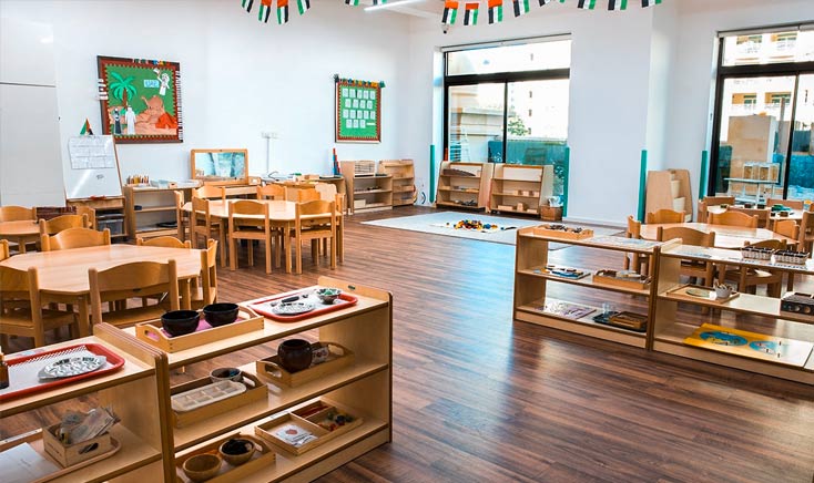 redwood-nursery-neatly-organized-classroom-with-wooden-desks-cabinets-and-chairs