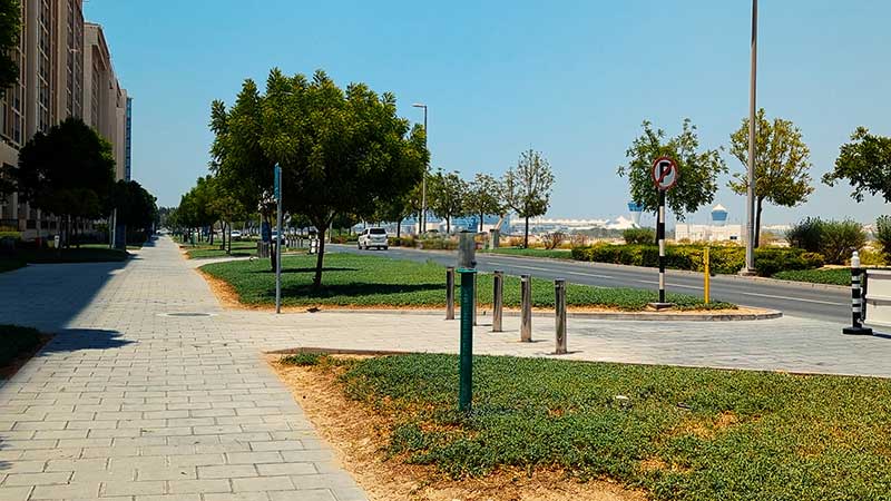 inside sidewalk and open spaces near Al Zeina