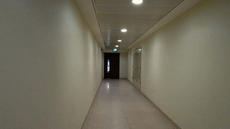 al Zeina hallway with door at the end