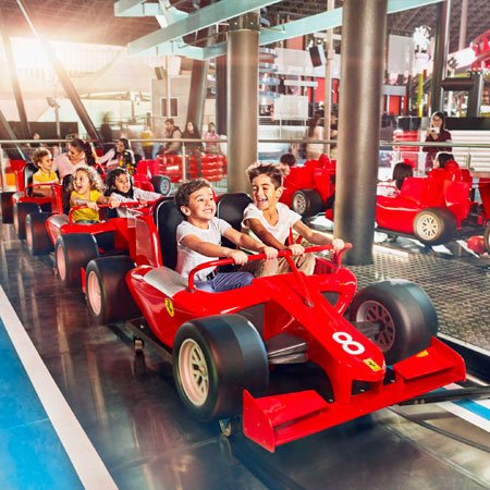 kids enjoying a ride in Yas Ferrari World