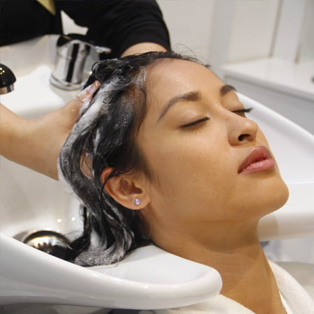 lady having her hair shampooed in filter ladies salon