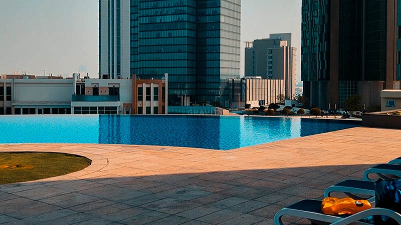 sun lounger and swimming pool in marina blue tower al reem island