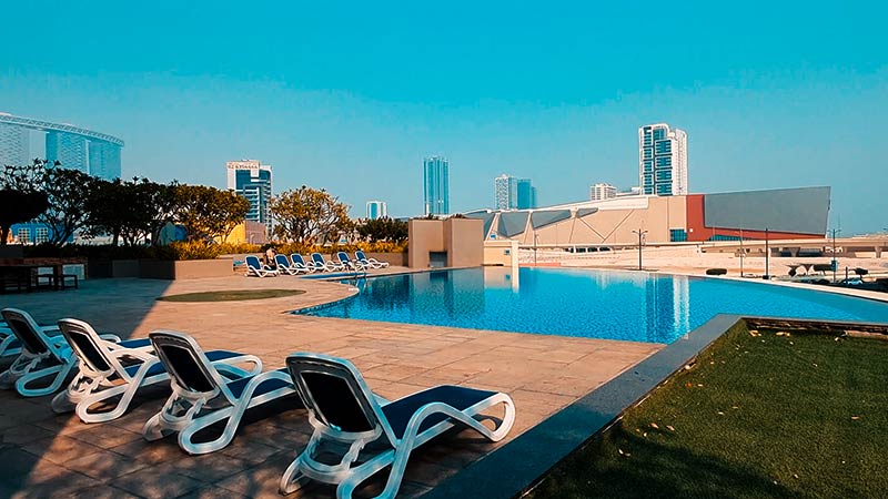 sun lounger and swimming pool overlooking marina square in marina blue tower al reem island