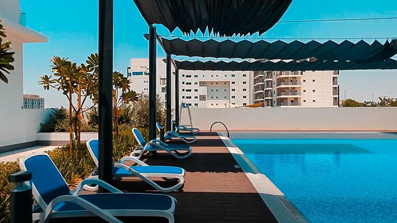 pool lounge chair beside the swimming pool