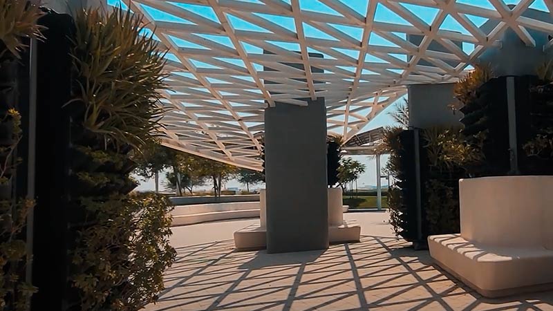 shaded bench area within Masdar City Central Park