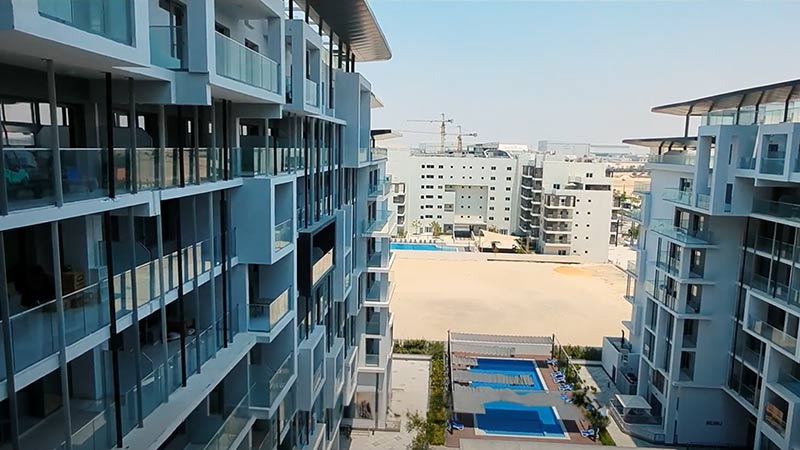 a view from the balcony overlooking the outdoor pool