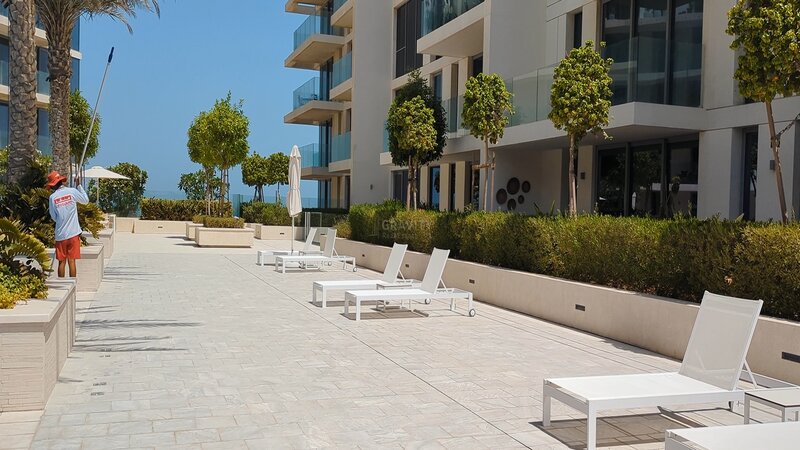 White sun loungers outside Mamsha Al Saadiyat building