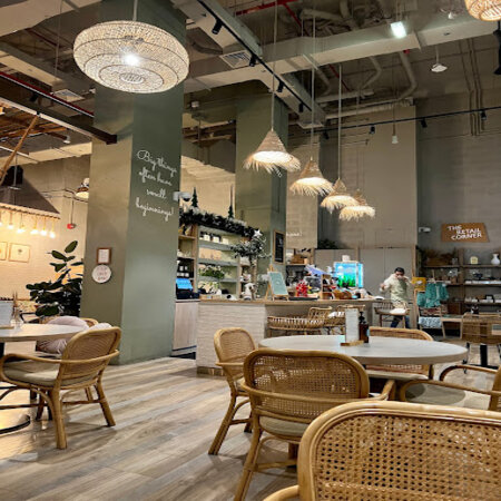 wooden chairs and lighting inside a restaurant