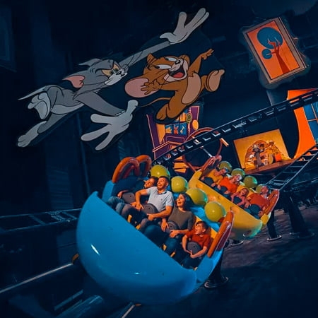 family enjoying the Tom and Jerry ride in warners bros yas island